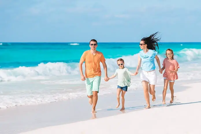 Young family vacation have lot fun on beach