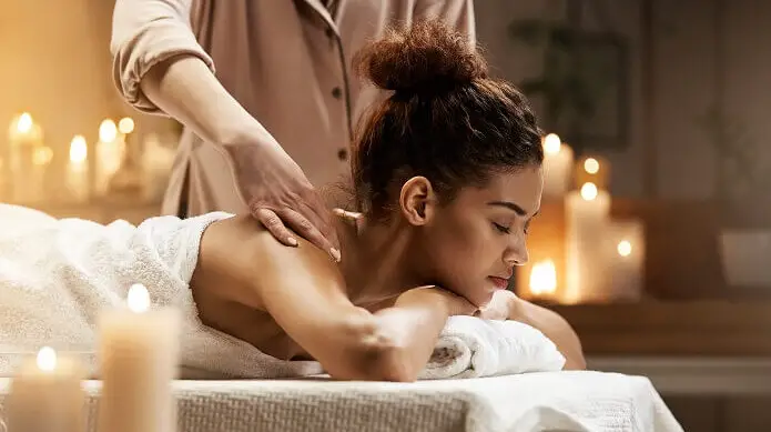 Woman enjoying massage with closed eyes